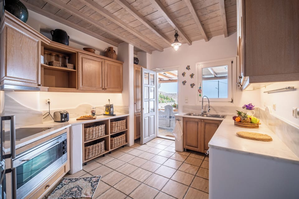 Villa | Private kitchen | Fridge, microwave, oven, stovetop