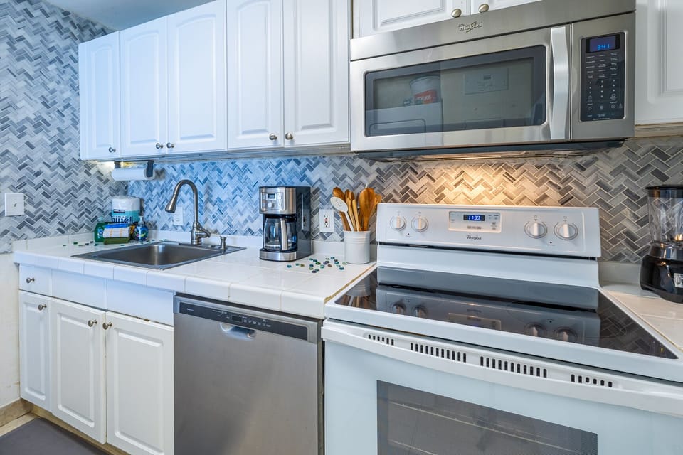 full kitchen with stove, oven, microwave and dishwasher