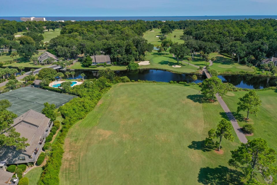 Mature trees and winding paths create a peaceful setting for golfers and walkers alike.