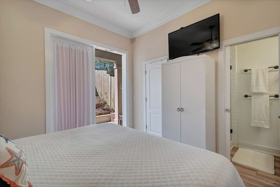 The bedroom and bathroom also provide a smart TV to enjoy during your stay. The back porch is directly out this bedroom.