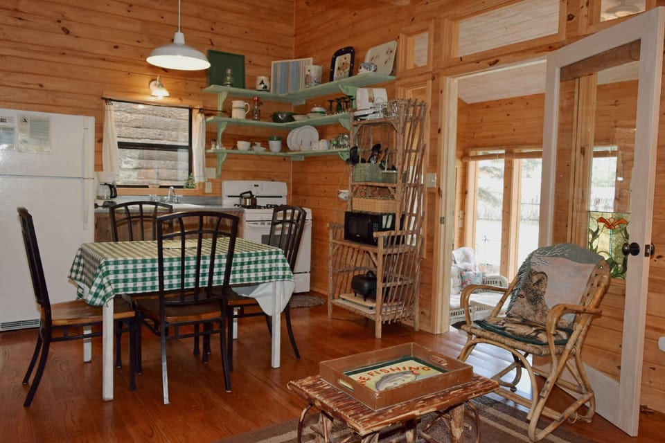 Unwind in the cozy heart of your cabin retreat, where warm wood surrounds you, rustic charm invites relaxation, and every detail whispers lakeside comfort.