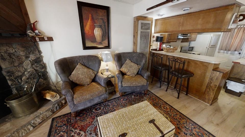 Unwind by the stone fireplace with a book, then step into your open kitchen for coffee. Every corner invites you to settle in and feel truly at home.