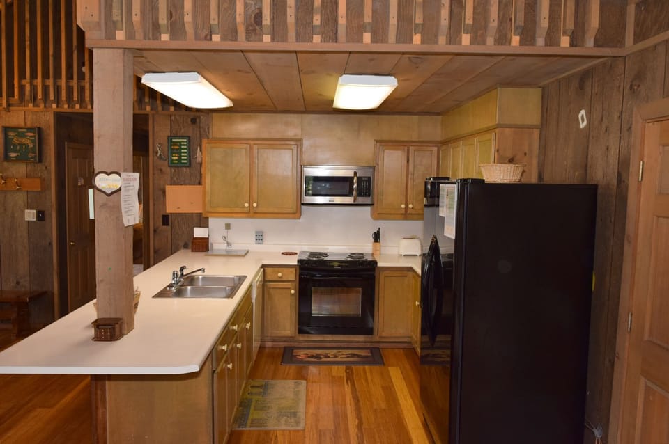 Your fully equipped kitchen features warm wood cabinetry, modern appliances, and generous counter space—everything you need to prepare delicious meals during your stay.