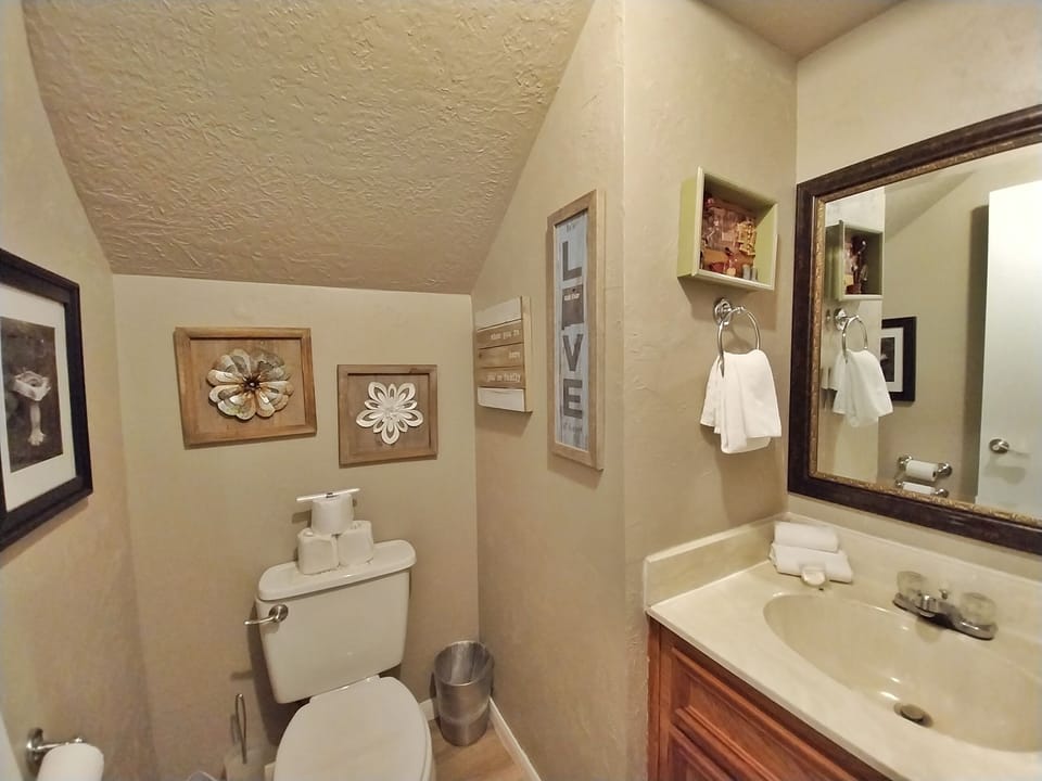 Freshen up in your private bathroom, thoughtfully decorated with warm touches and stocked with fresh towels for your comfort.