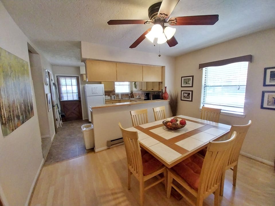 Gather around the inviting dining table where you'll share meals, stories, and laughter. The open kitchen makes it easy to prep and serve, keeping everyone connected during your stay.