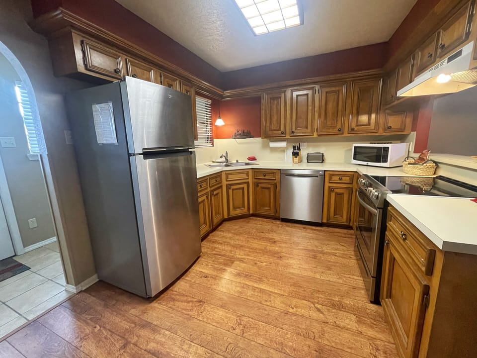 A fully equipped kitchen ready for you to prepare your favorite meals, featuring stainless steel appliances, ample cabinet space, and everything you need to feel at home.