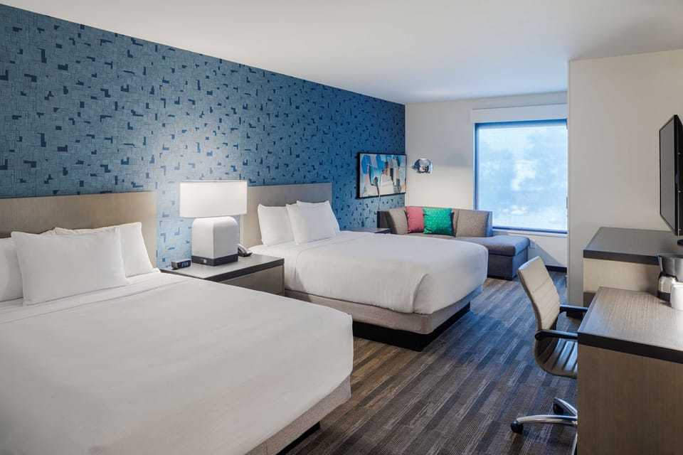 Room, 2 Queen Beds | In-room safe, desk, laptop workspace, blackout drapes