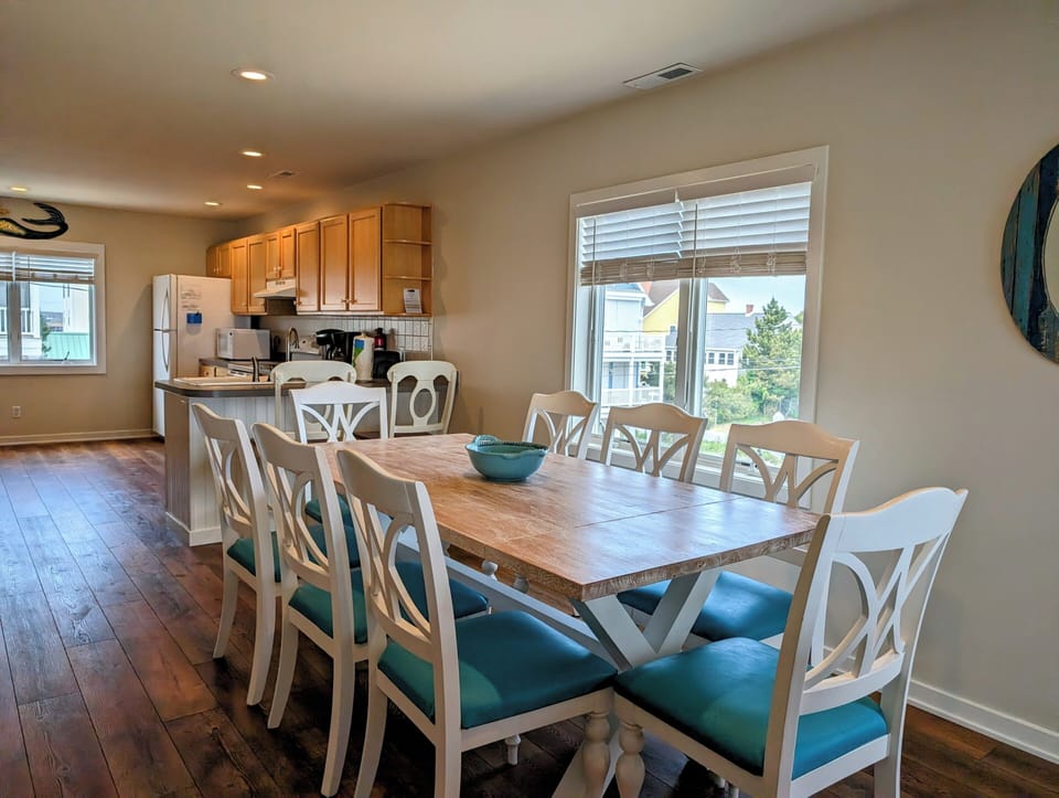38901 Bunting Avenue Kitchen and Dining Area Flow - A perspective of the kitchen showcasing the functional layout and the transition into the adjacent dining space.