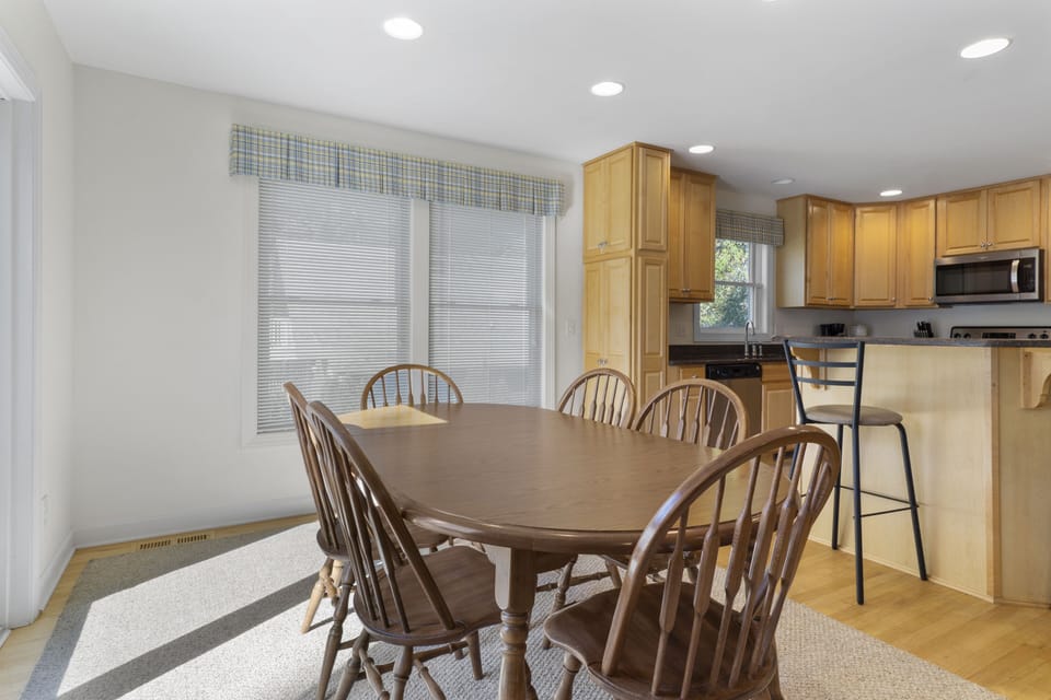 511 Doral Drive - Kitchen View from Dining - Perspective showing the seamless connection between the dining area and the fully equipped kitchen, ideal for family gatherings.