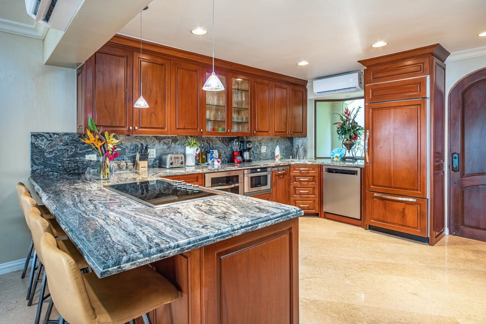 Spacious and modern kitchen in a beautiful Playa Flamingo condo, offering luxury and comfort just steps from the white sands
