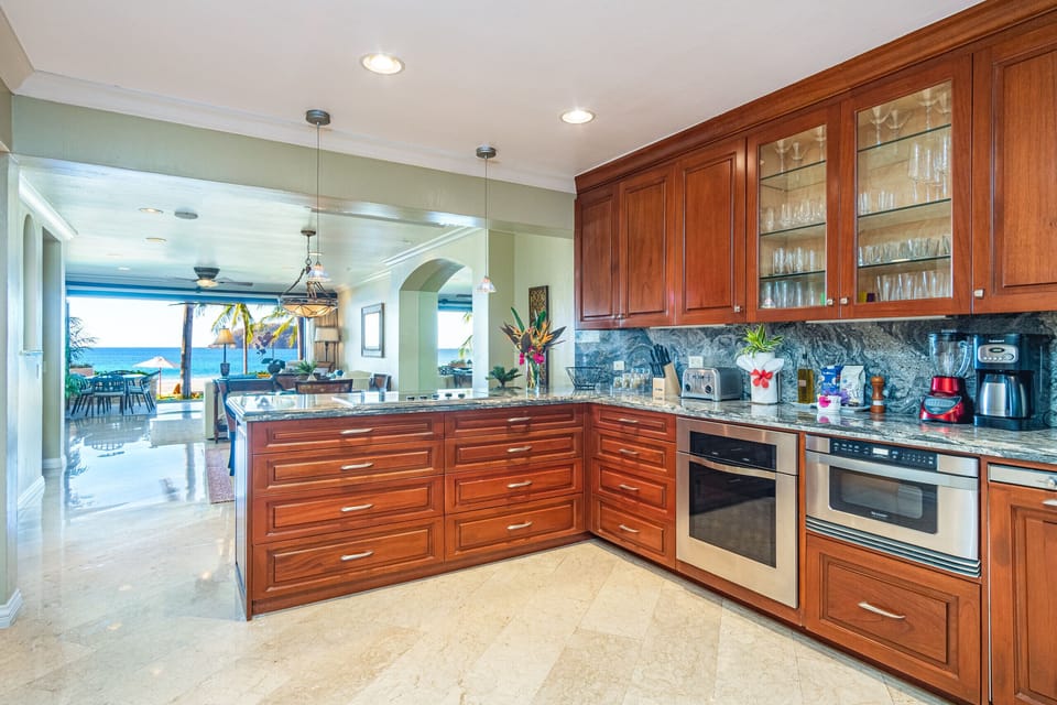 Spacious and modern kitchen in a beautiful Playa Flamingo condo, offering luxury and comfort just steps from the white sands