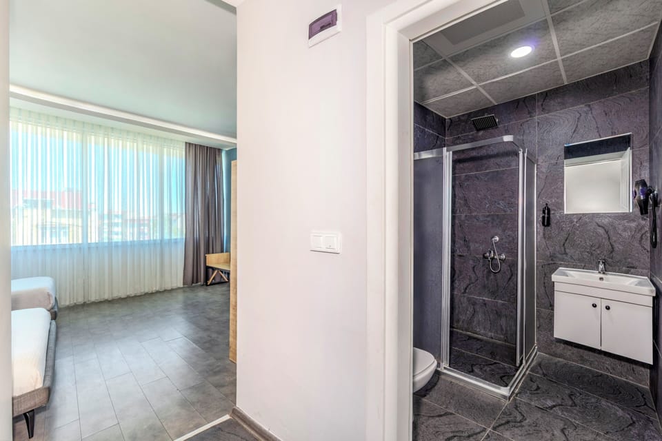 Shower, rainfall showerhead, designer toiletries, hair dryer