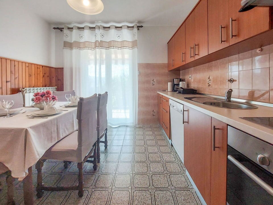 Flooring, Interior Design, Furniture, Floor, Countertop, Kitchen, Kitchen & Dining Room Table, Cabinetry, Room, Chair
