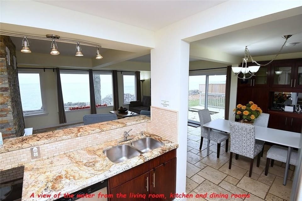 A view of the water from the living room, kitchen and dining rooms