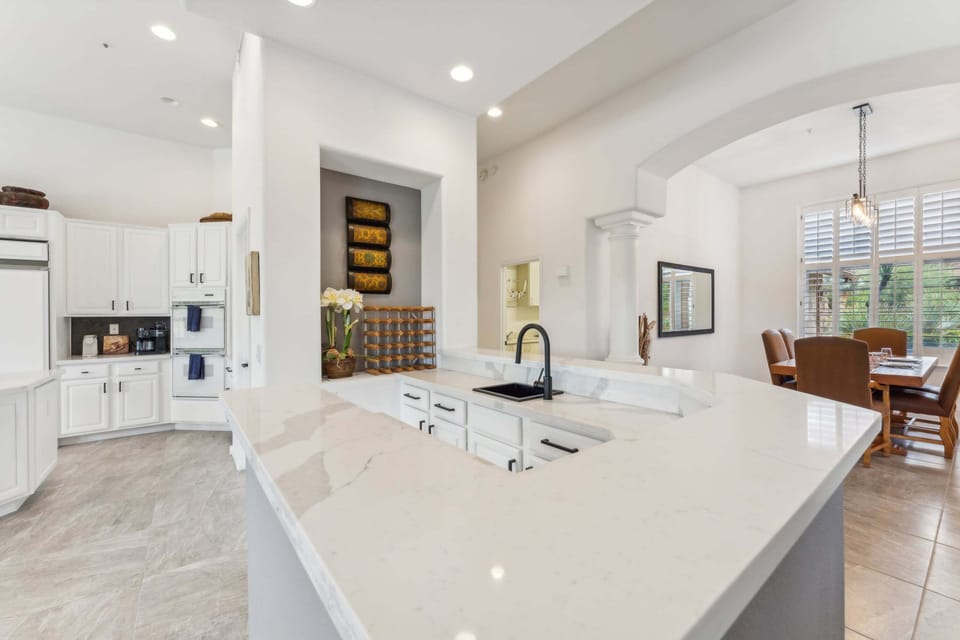 Watch over all the action from the wet bar! Views to all common spaces.
