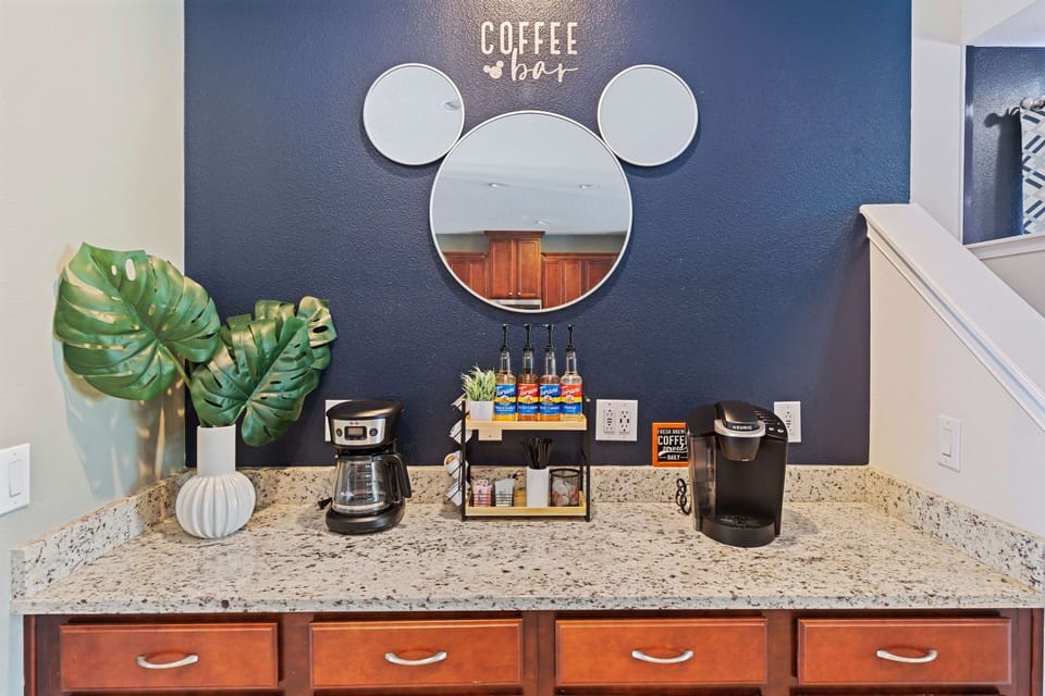 Coffee bar w/ a traditional pot and Keurig, plus complimentary starter supplies