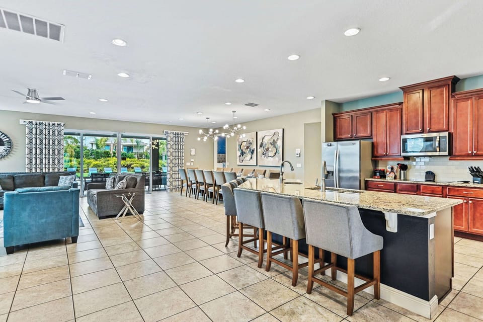 The open concept kitchen has two ovens, two dishwashers and two refrigerators!