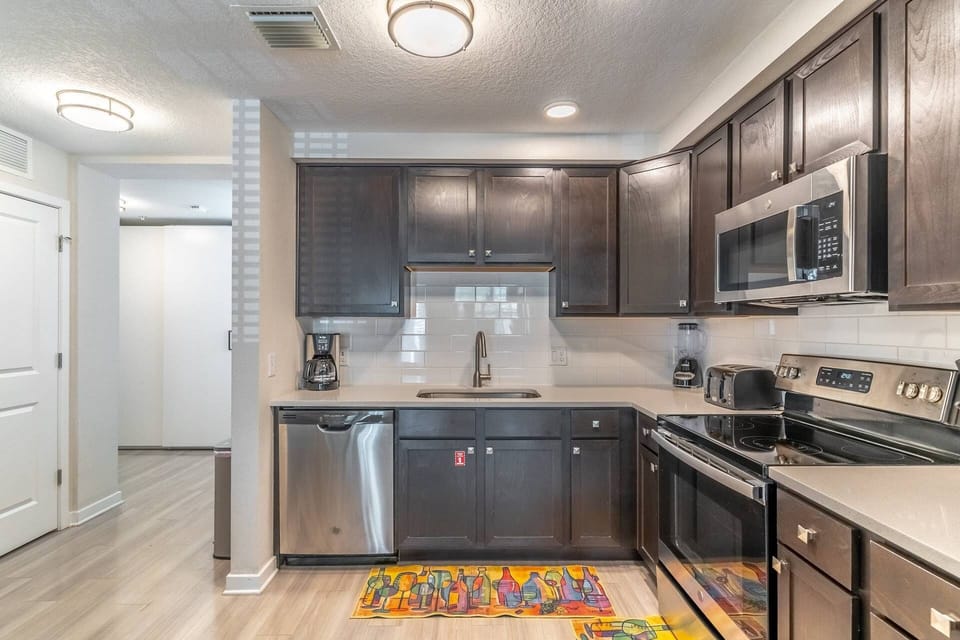 Fully stocked, modern and clean kitchen with stainless steel appliances