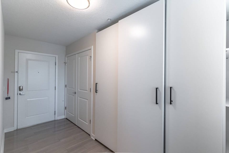 Wide entry way with access to full sized laundry in unit