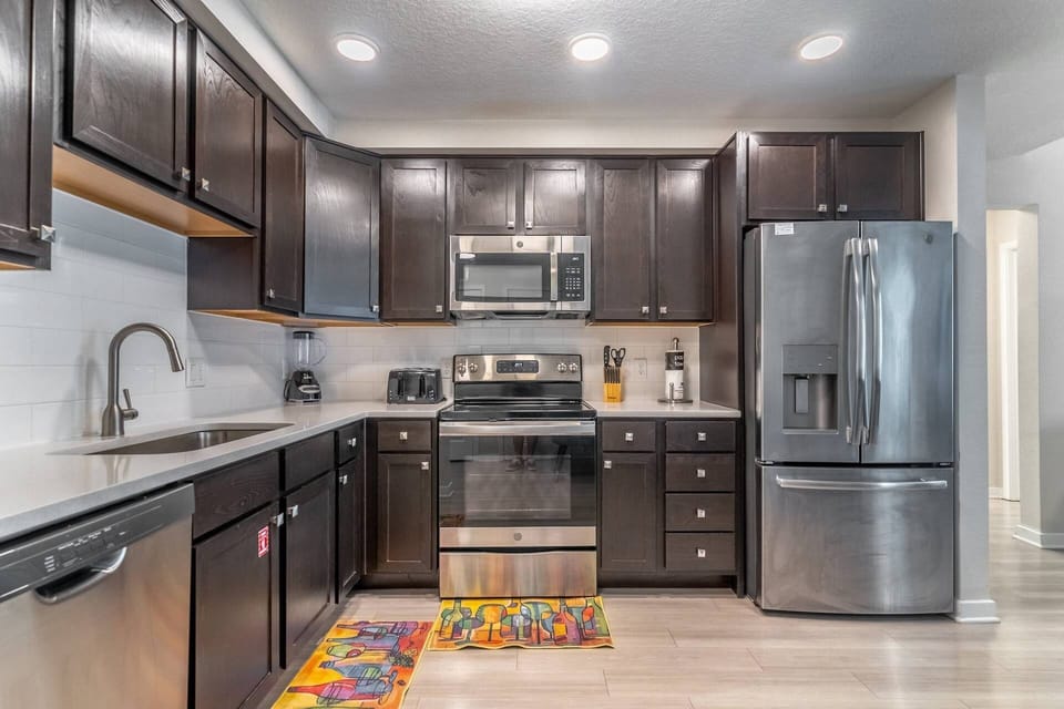 Fully stocked, modern and clean kitchen with stainless steel appliances