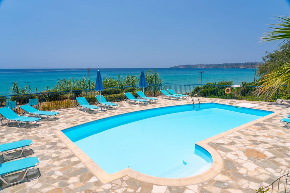 Seasonal outdoor pool, pool umbrellas, sun loungers