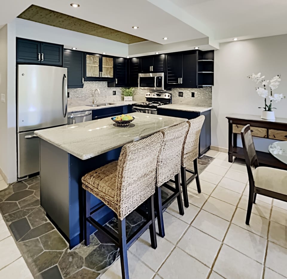 Enjoy serving your guests at the kitchen countertop with bar seating for three