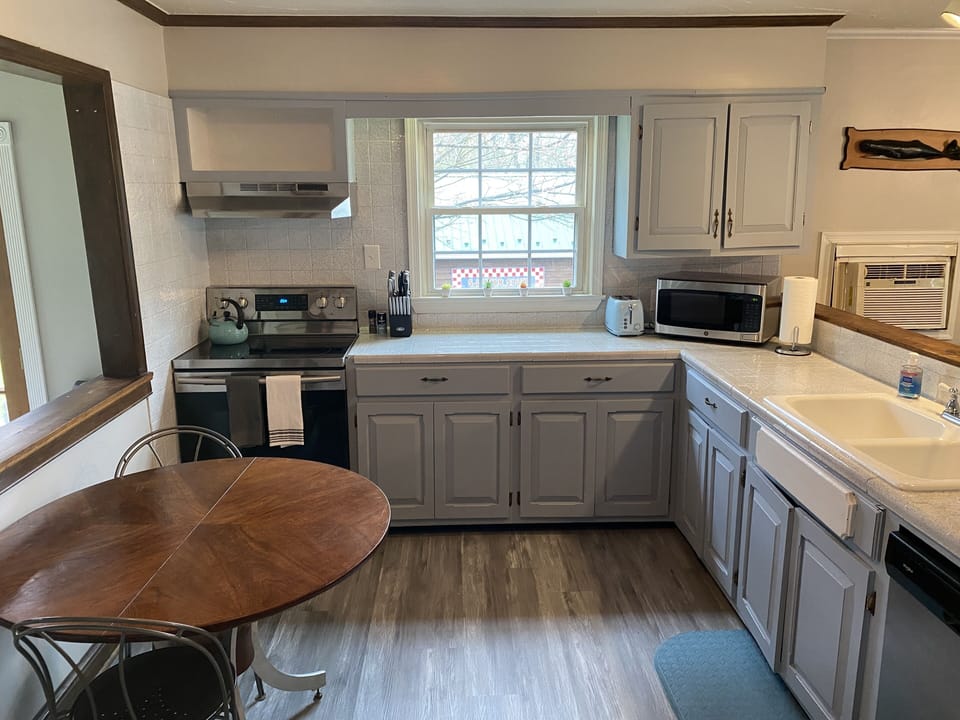 KITCHEN - 2nd Floor spacious, fully stocked with cooking pans, and eating dishes