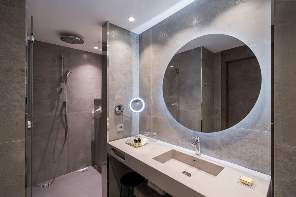 Eco-friendly toiletries, slippers, bidet, towels