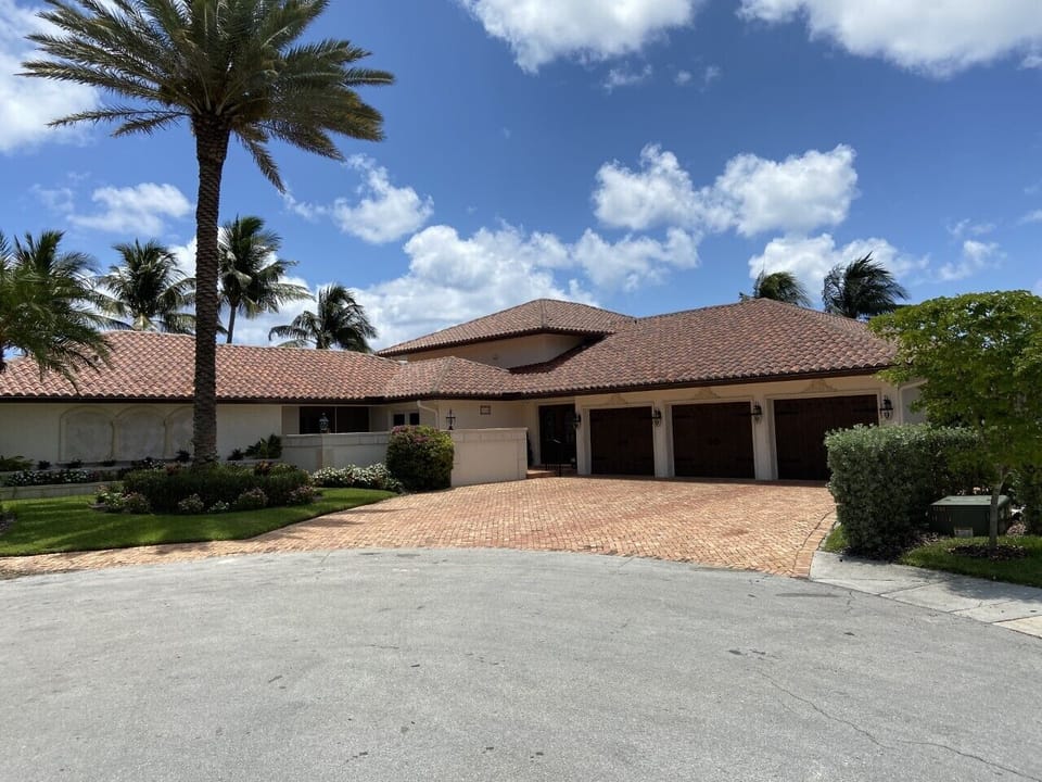 Street view with 3 car garage. 