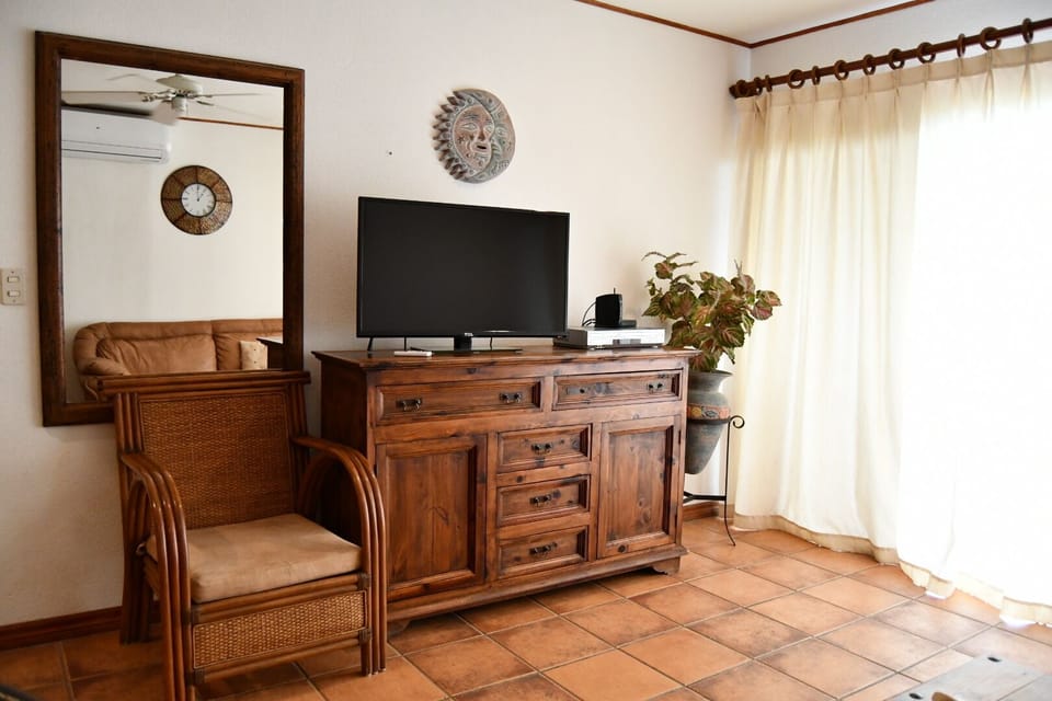 Smart TV in the living room, Across from the Sofa