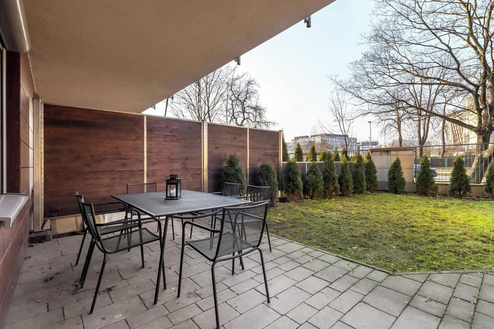 A cozy outdoor space with a seating area overlooking greenery. Perfect for relaxing.