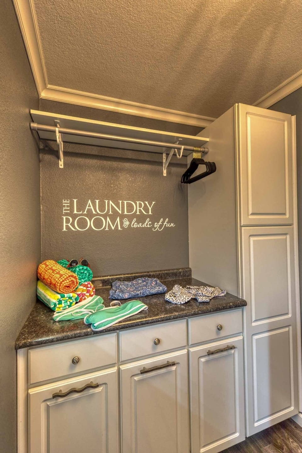 Full laundry area with washer & dryer, plant of room to dry swimsuits & towels