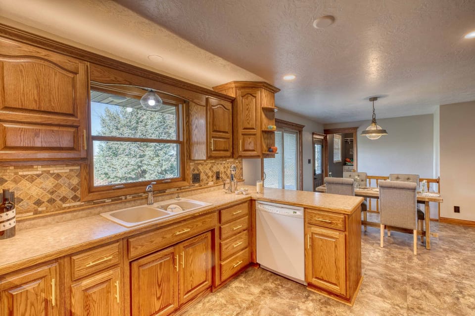 Kitchen/dining area open on the main floor and sliding door to the back patio.