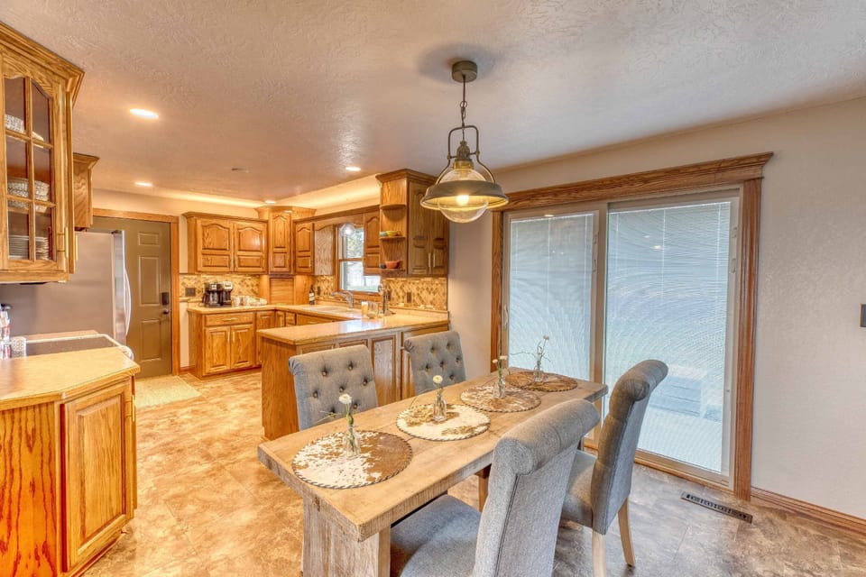 Kitchen/dining area open on the main floor and sliding door to the back patio.