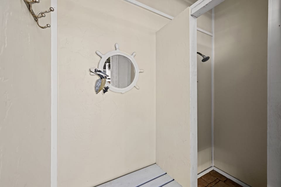 Rinse away the sand in the outdoor shower.