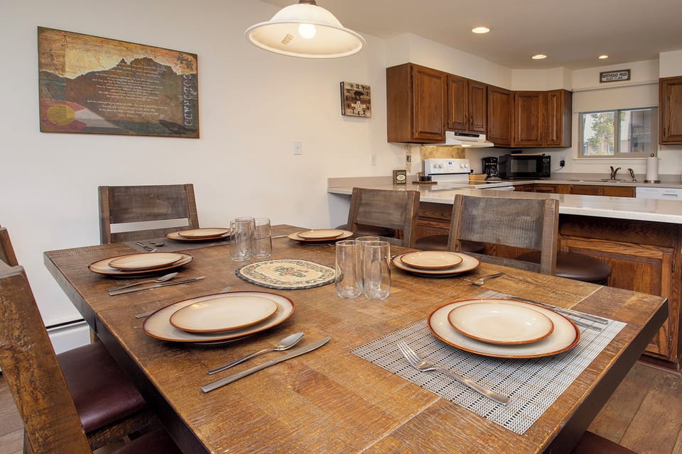 Gather around this rustic dining table where your group can enjoy home-cooked meals together in the open kitchen space.