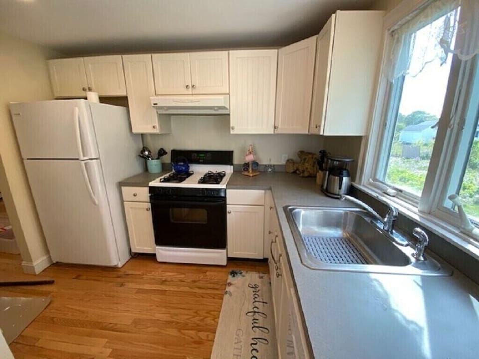 Full Kitchen with gas stove, dishwasher and refrigerator. 