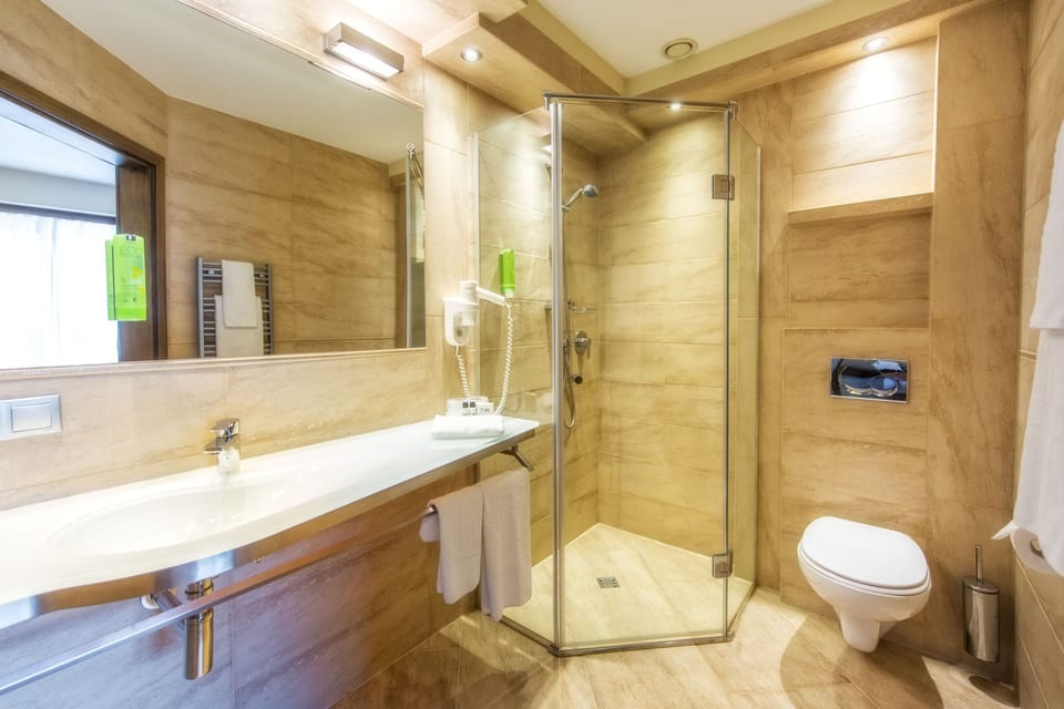 Superior Room | Bathroom | Hair dryer, bathrobes, slippers, heated floors