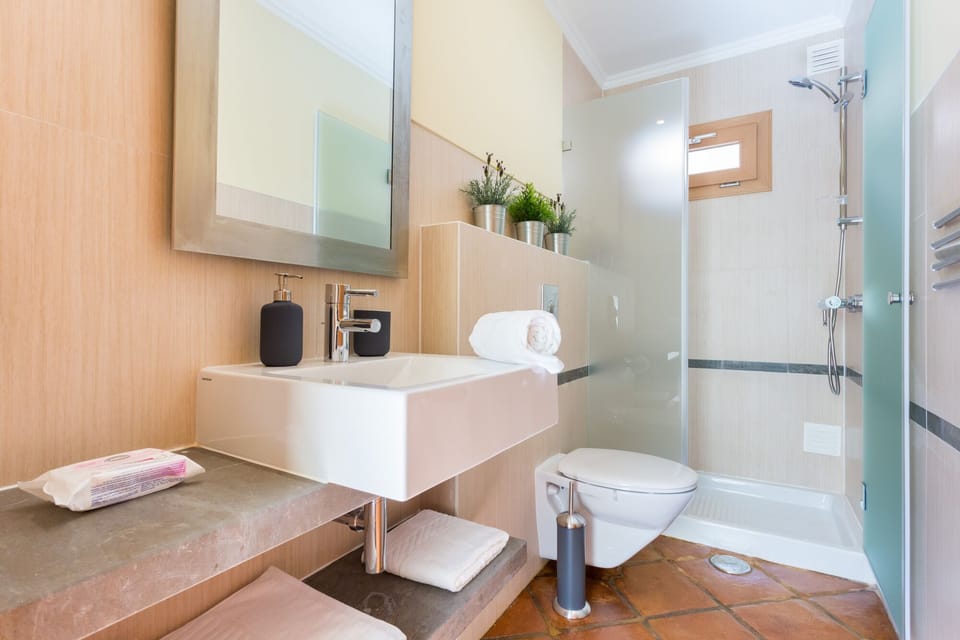 Bathroom 2 with Shower, WC and hand basin located next to Twin Bedroom