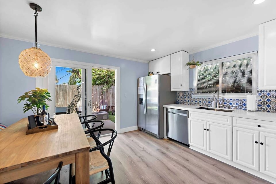 Table seats 6 comfortably and the back yard is just off the kitchen if you prefer to eat outside.