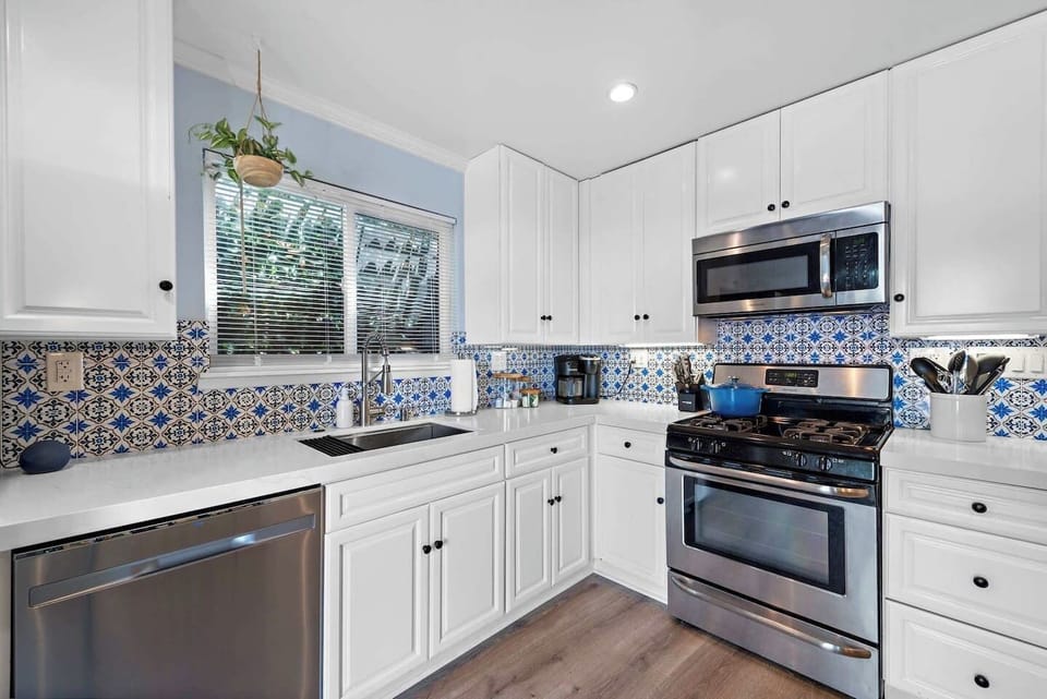 Beautiful kitchen outfitted with everything you would need to prepare and enjoy meals here with your family and friends. Granite countertops and newer appliances.