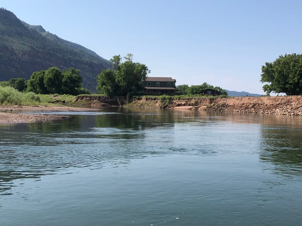 Looking at the house from a canoe on the Animas River 