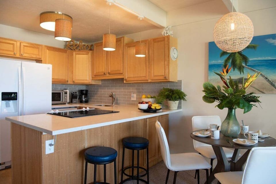 A cozy kitchen and dining space with warm wood accents, perfect for casual bites or family feasts.