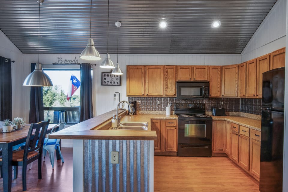 Cabin D: Full kitchen with all utensils plus *Toaster *Coffee Maker
