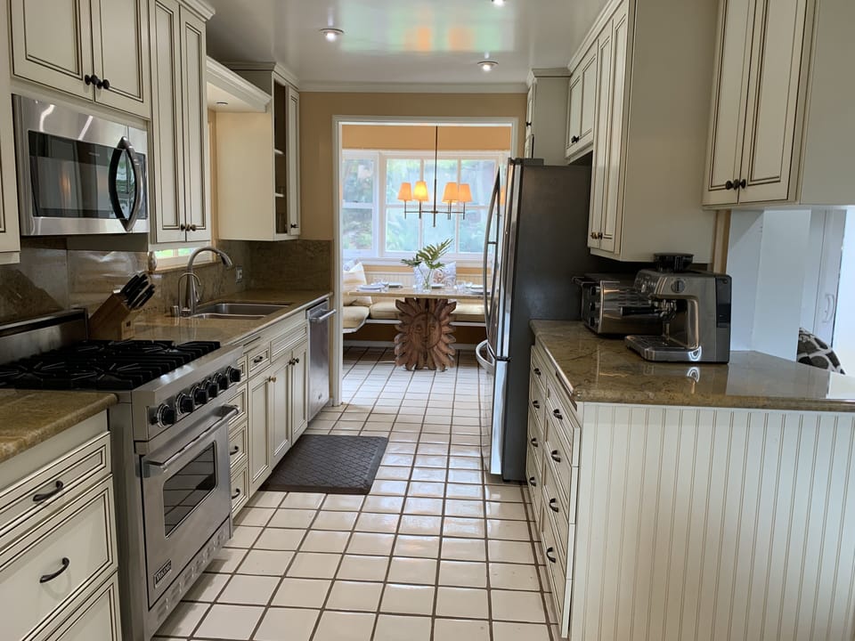 Galley style, fully stocked kitchen.