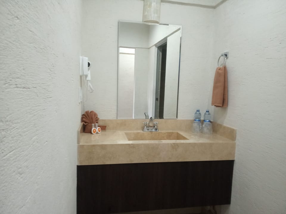Shower, rainfall showerhead, hair dryer, towels
