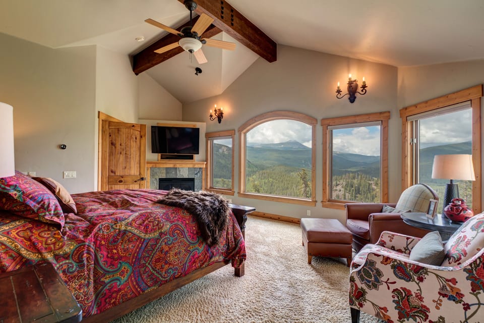 Upstairs Bedroom with fireplace and mountain views