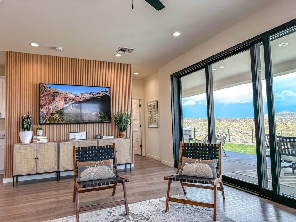Large living room with beautiful modern chic design. New and constantly updated for fresh look and feel. Large television with access to high speed internet, WIFI and sign in to your favorite channels.  Host large groups with plenty of seating. 