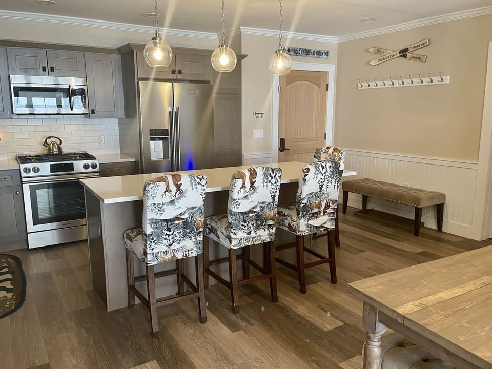 Kitchen island seats 4 comfortably and Entry Way with coat hooks 