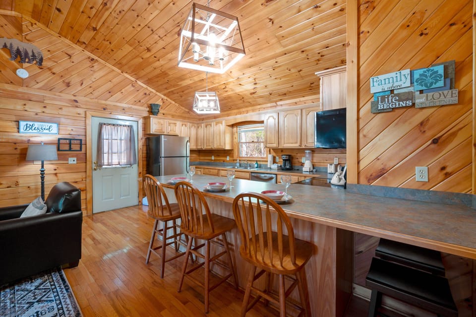 Kitchen door leads straight out onto the porch where you'll find a dining table.